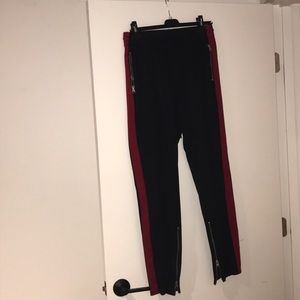 Black sweatpants with red stripe